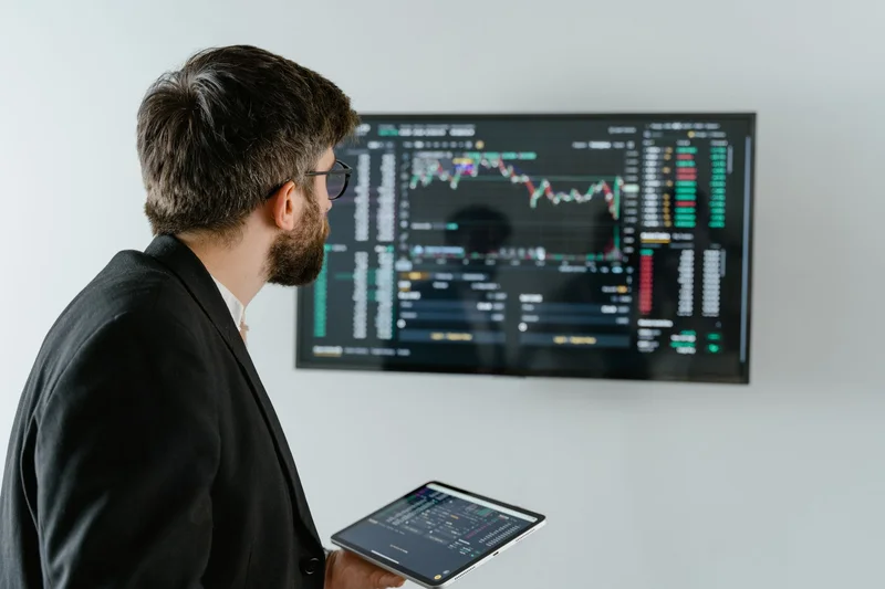 Analyst studying corporate earnings and market valuation information